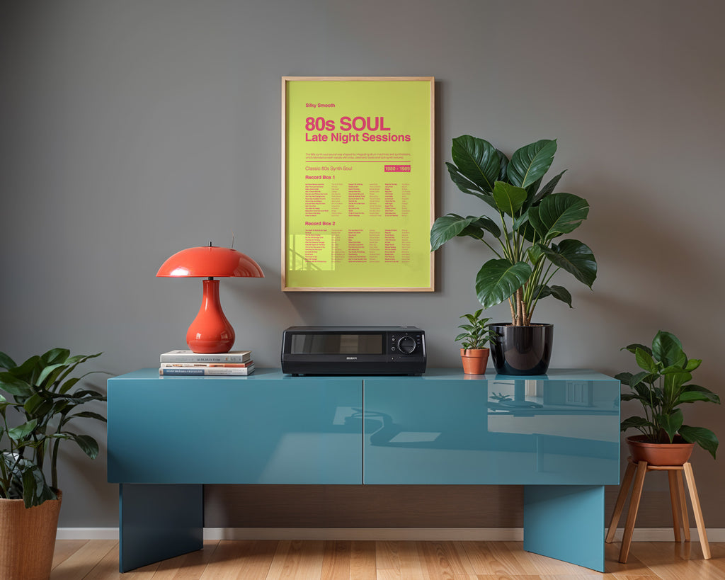 80s Synth Soul music print hanging in a black frame on a grey wall above a blue sideboard with gentle window reflections across the frame. Suitable for A1, A2 and A3 sizes. Acid yellow background with electric pink text (Mockup M06).