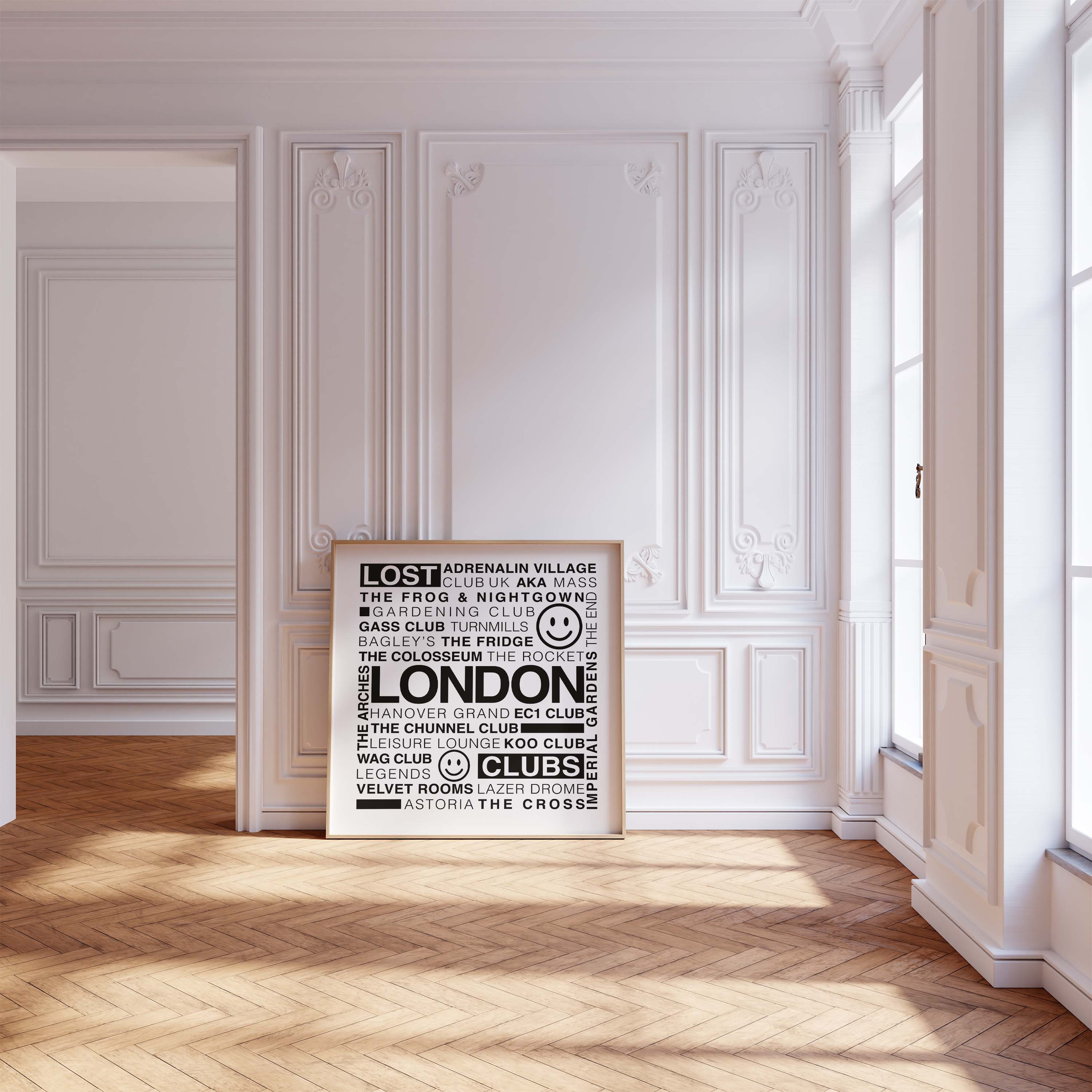 Lost London Clubs square black text print displayed in a wooden frame leaning on a wood floor against a white ornate wall
