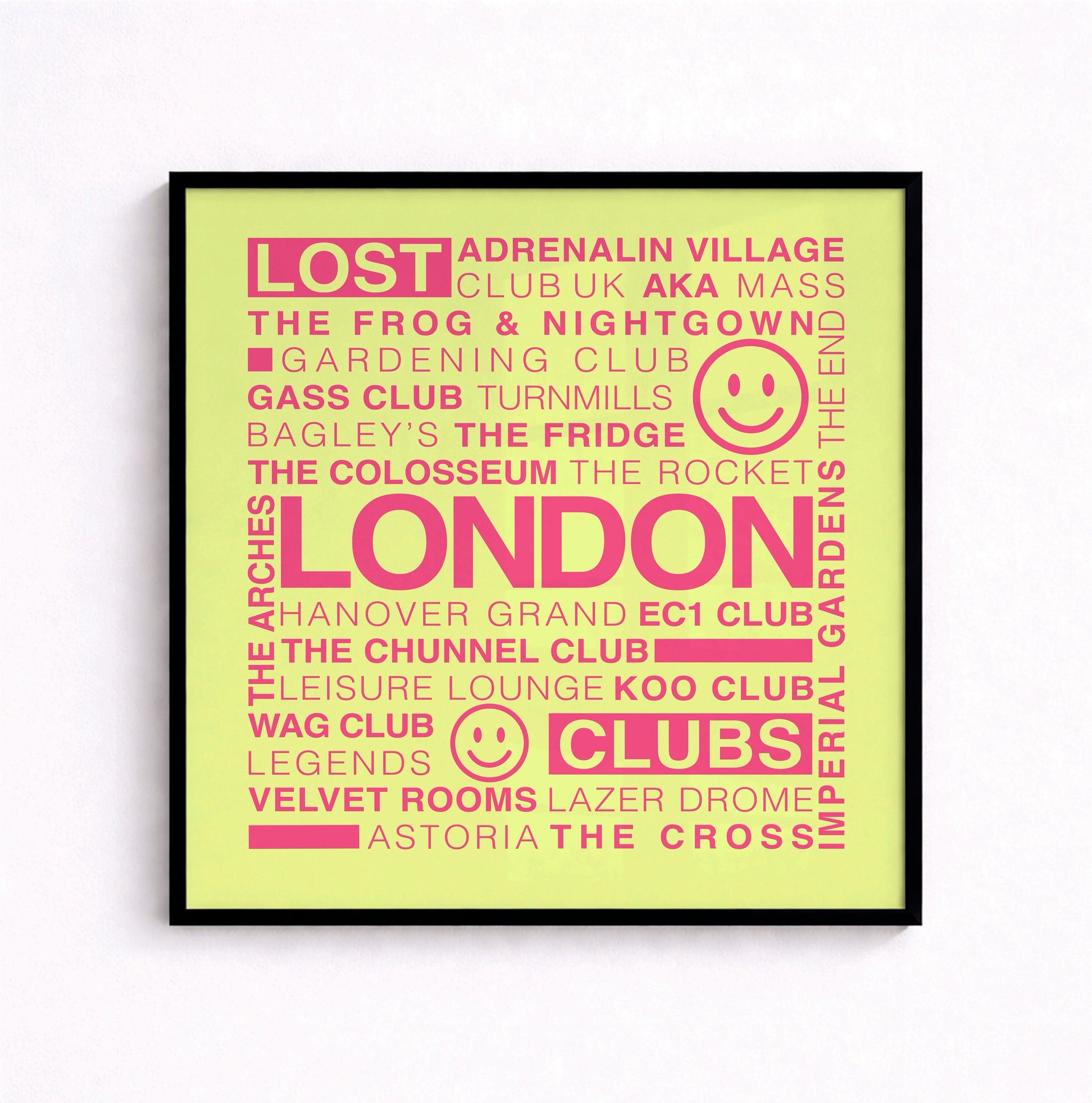 Lost London Clubs square print with electric pink text on an acid yellow background displayed in a black frame hanging on a white wall